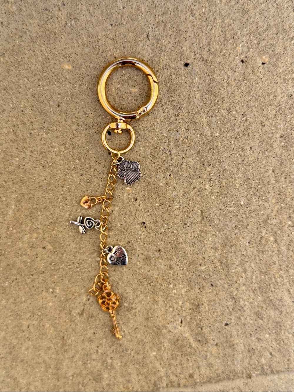 Gold tone and silver keyring with Key, Lock,  Paw, Heart and Key Charms
